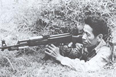 A Vietnamese Guerrilla fighter with his AK-47
