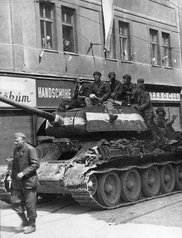 Legendary T-34 Tank with Waving Red Banner = Soviet T-34 tank with waving  red banner at the beginning of Tverskaya street in the background of hote  Stock Photo - Alamy