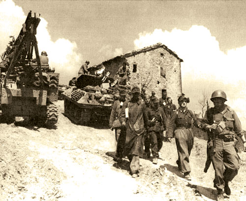 10th Mountain Division troops escort German prisoners of war