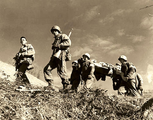 10th Mountain Division troops taking wounded to the rear