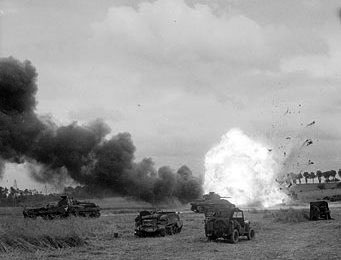A German Mortar round hits a division vehicle