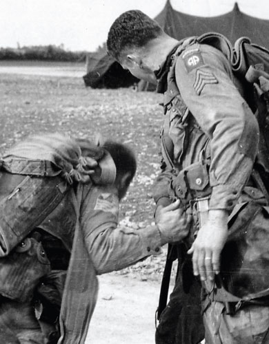 American paratroopers check their gear